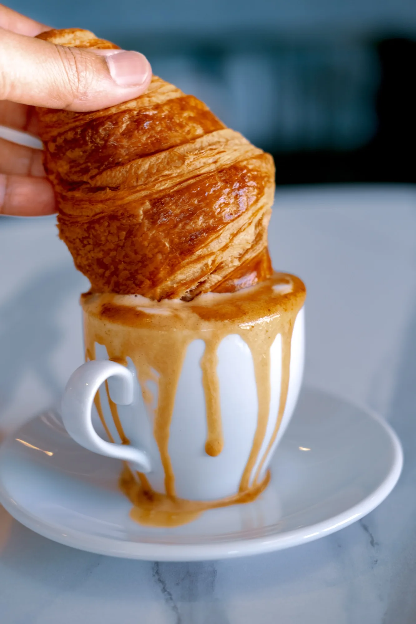 Croissant dipped in caramel espresso
