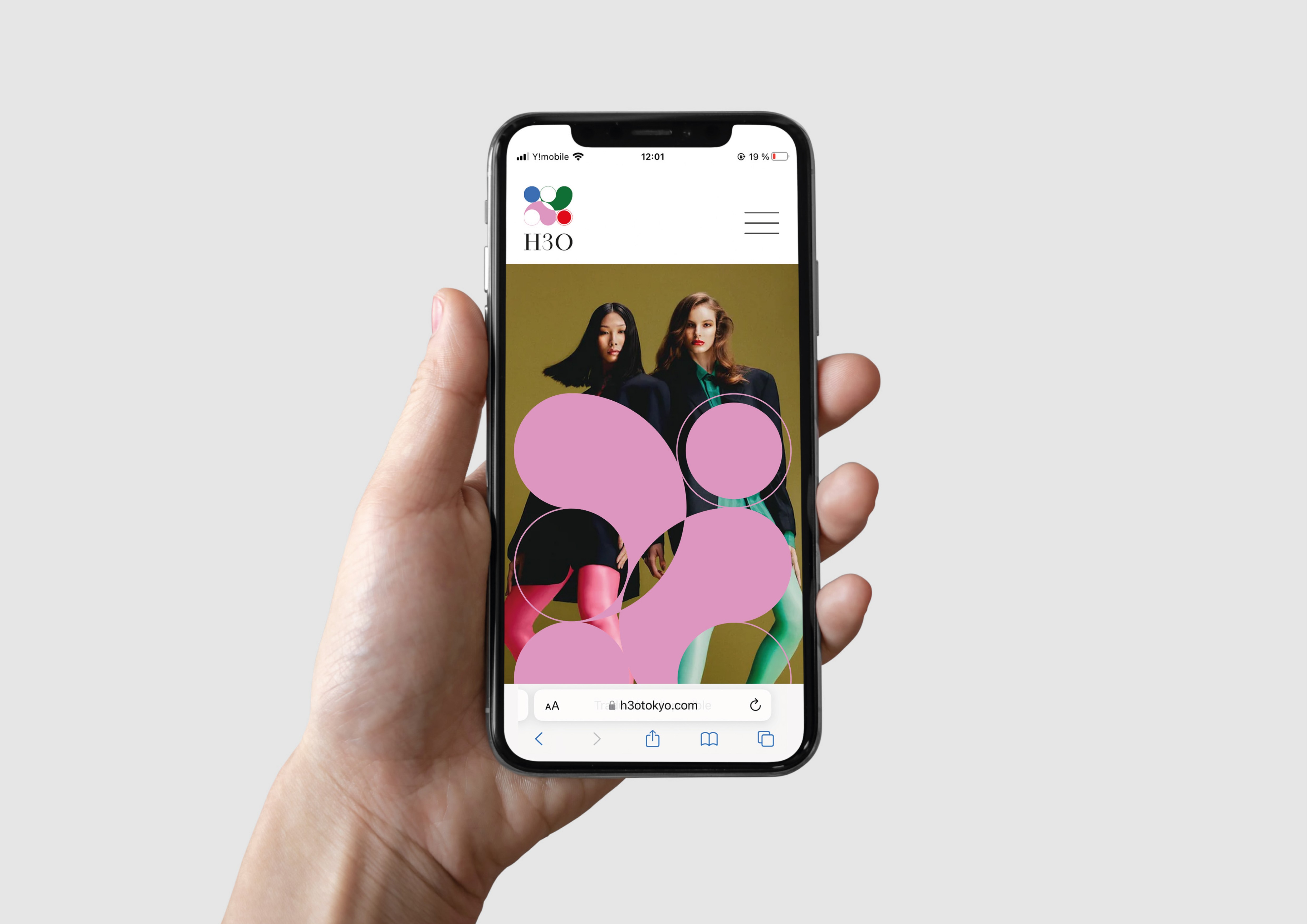 Smartphone mockup showing H3O’s webstie page with the colorful circular logo system.