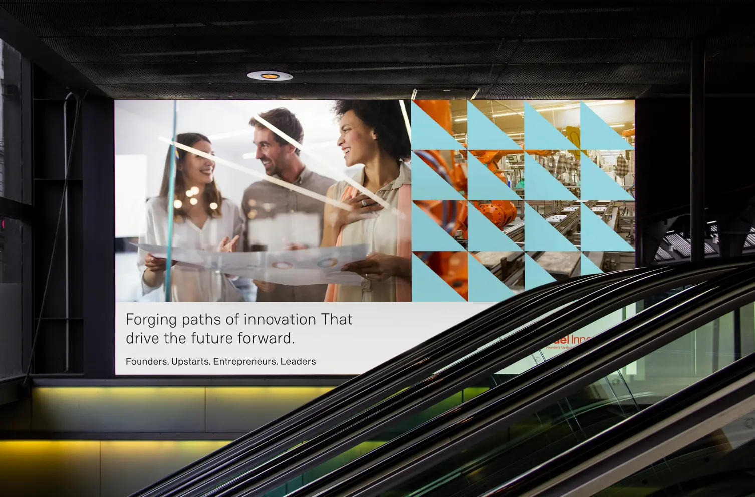 A digital screen in a sleek transit lobby shows people collaborating behind a glass divider, with the text "Forging paths of innovation That drive the future forward." and "Founders. Upstarts. Entrepreneurs. Leaders," plus geometric brand visuals. It