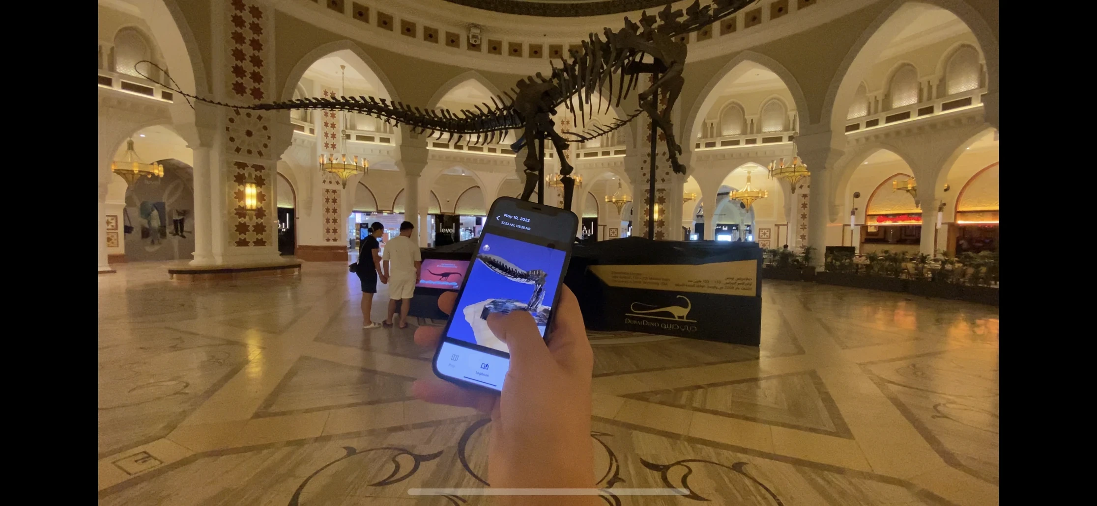 Web AR app displaying a dinosaur skeleton in a mall.