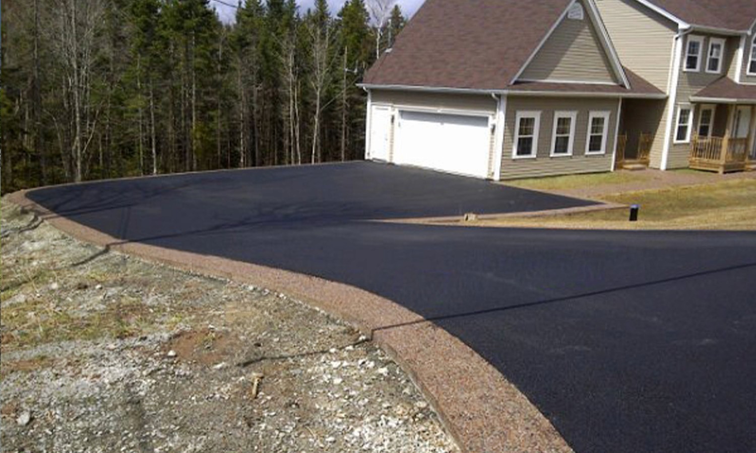 exposed curb and ashpalt driveway