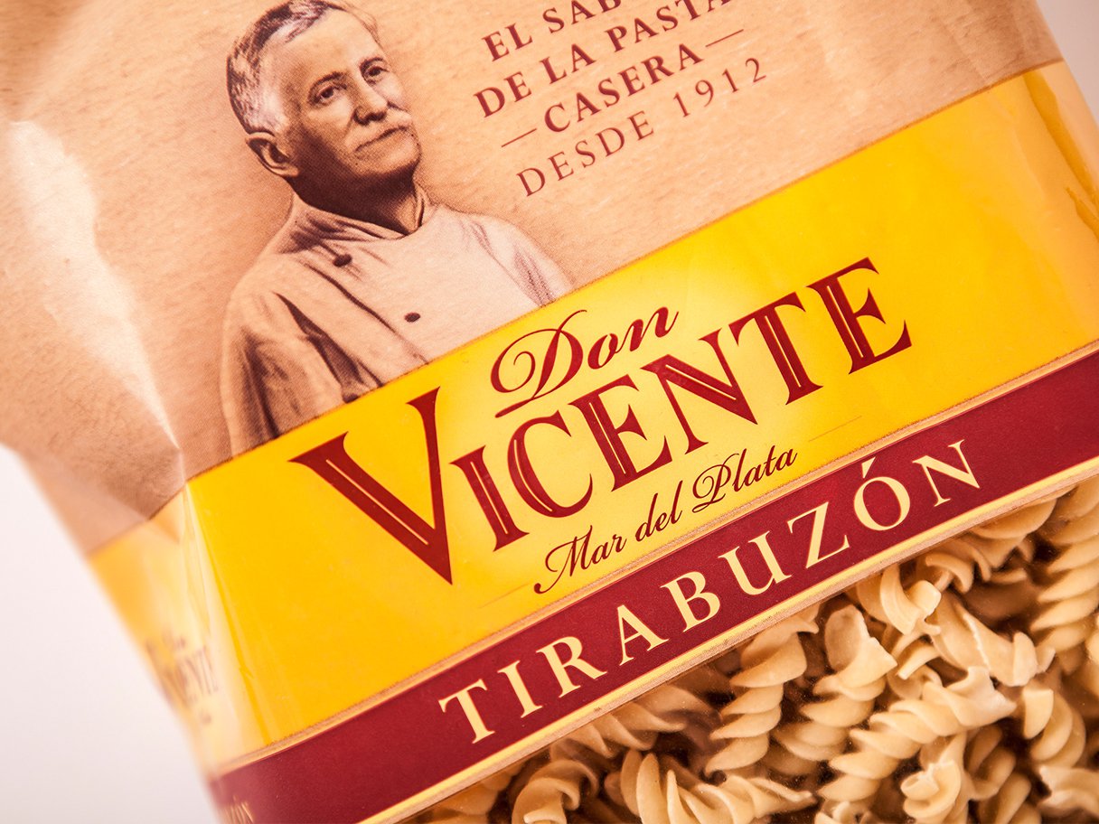 Rooftops of a coastal town with the sea in background