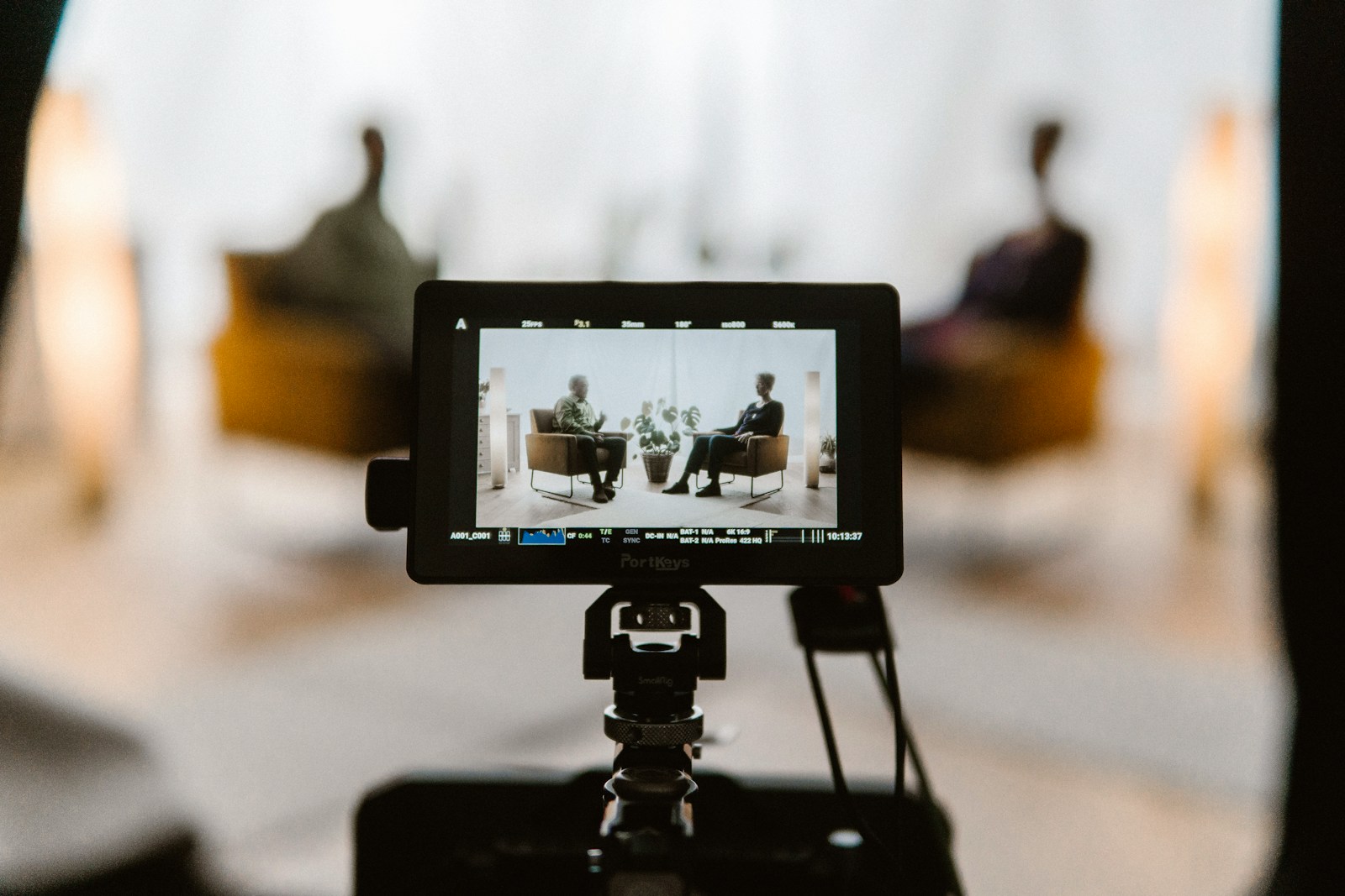 A tripod with a camera attached to it