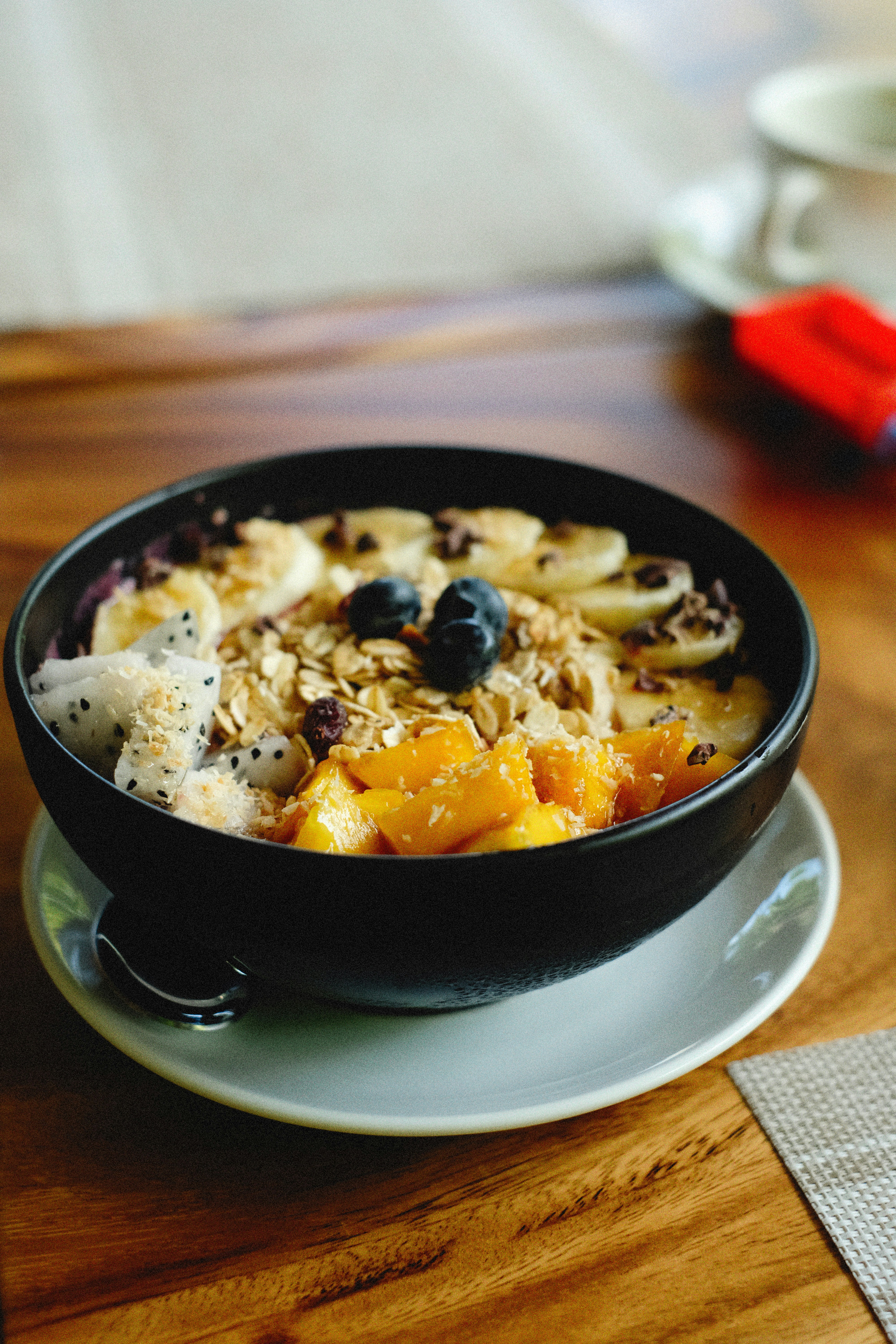 a bowl of food on a plate on a table