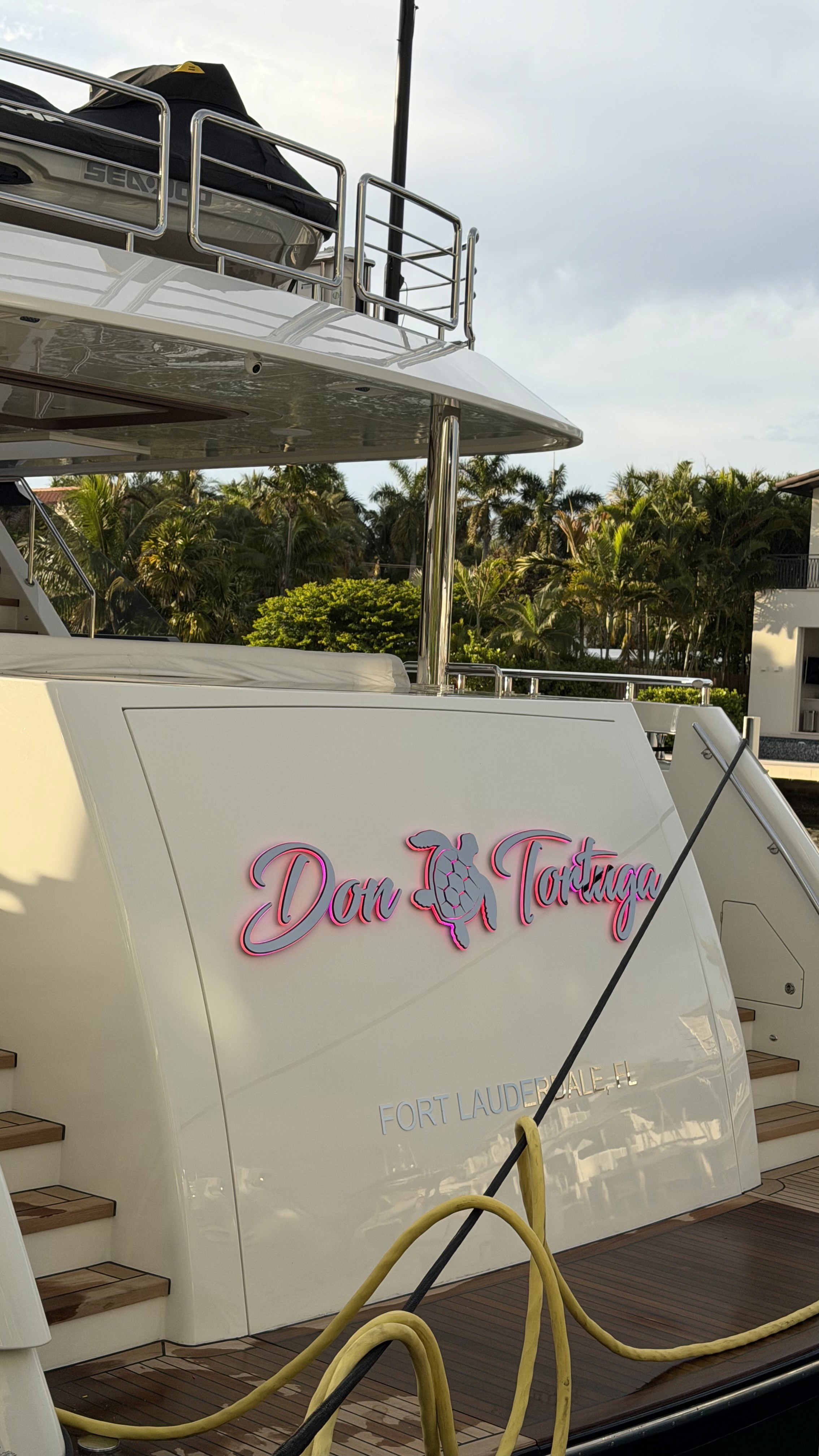 Custom vinyl yacht name lettering and graphics on boat transom in Fort Lauderdale