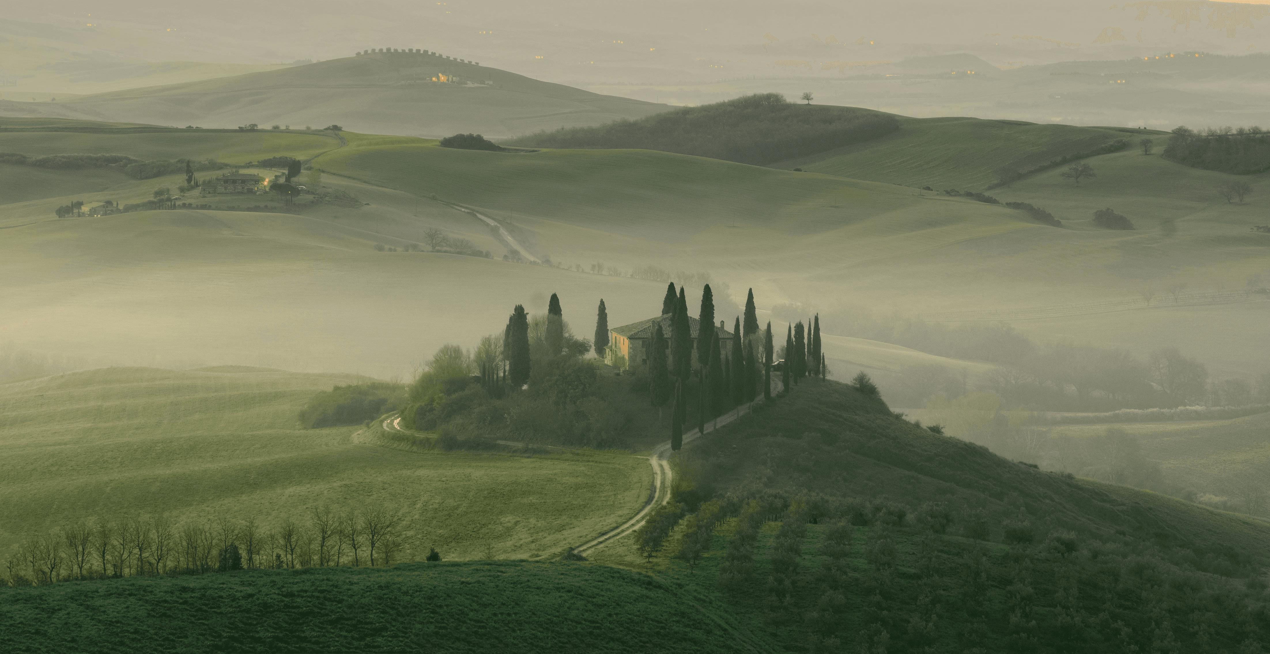 house in middle of grass field