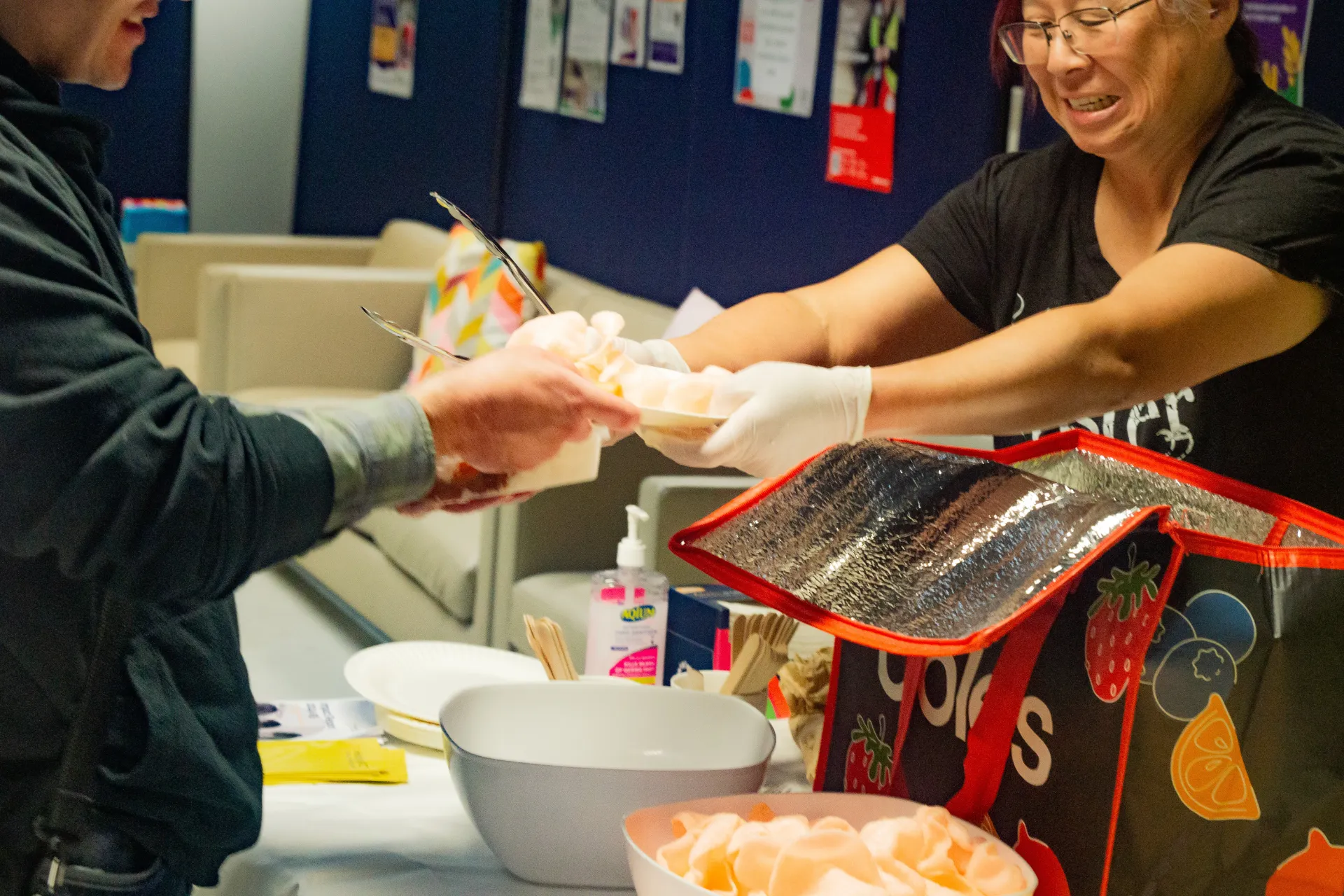 Person receiving food at the community dinner