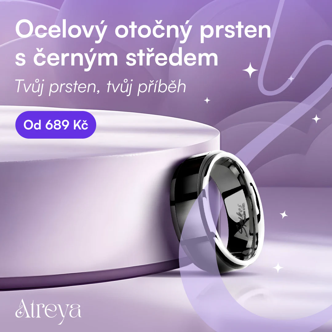 Steel spinner ring with a black band on a purple product podium.