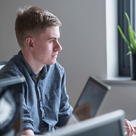 Male worker concentrating on designing content