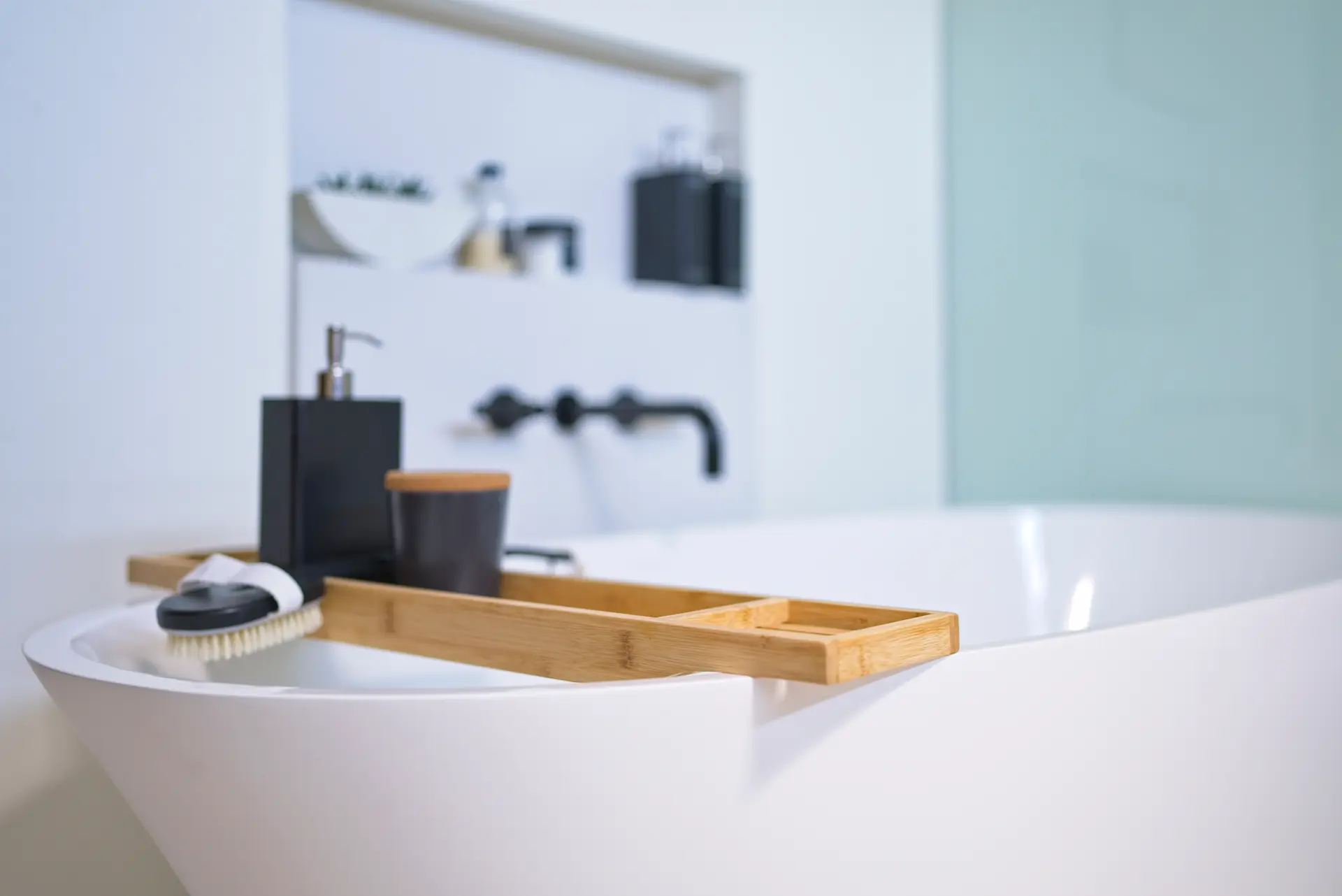 Close-up view of the free-standing tub from angle two, showcasing its design and fixtures in the Fairhaven Eichler Tract remodel. Photo by Todd Huge.