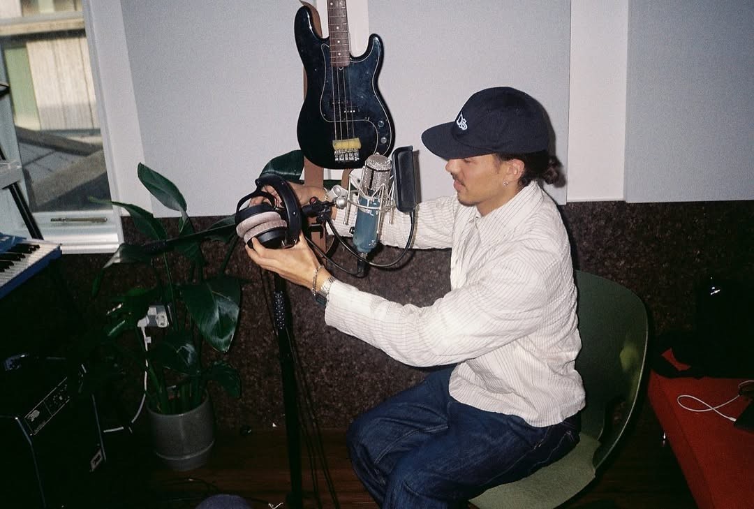 indie artist with guitar and microphone
