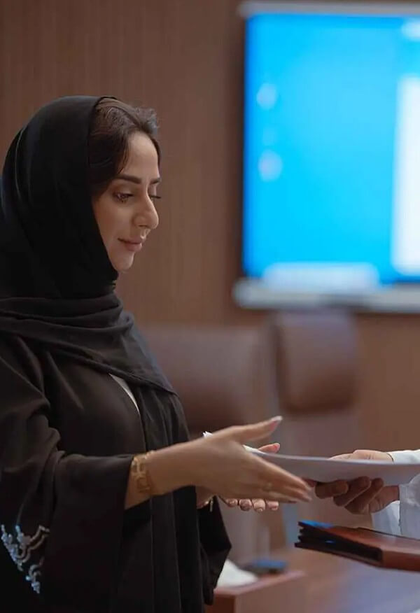 Professional handing over documents. Secure excellent office space and reliable service at a premium coworking space.