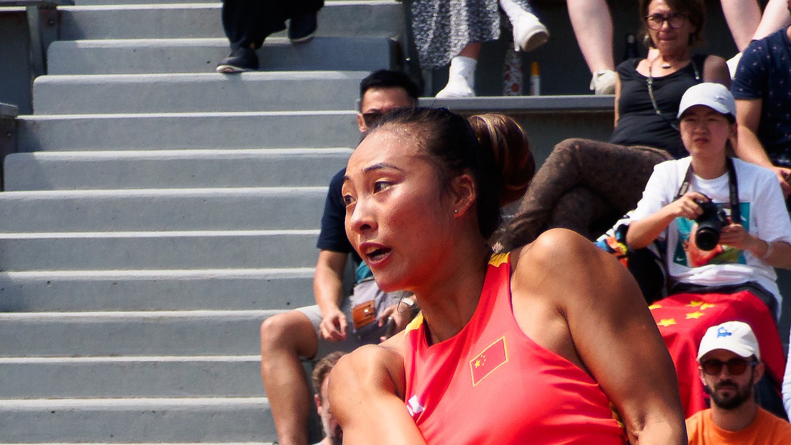 Close-up of Zheng Qinwen at the Paris Olympics, face centered