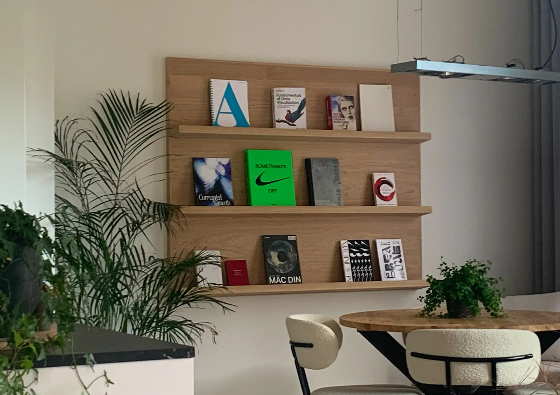 A big wallmounted wooden bookshelf.