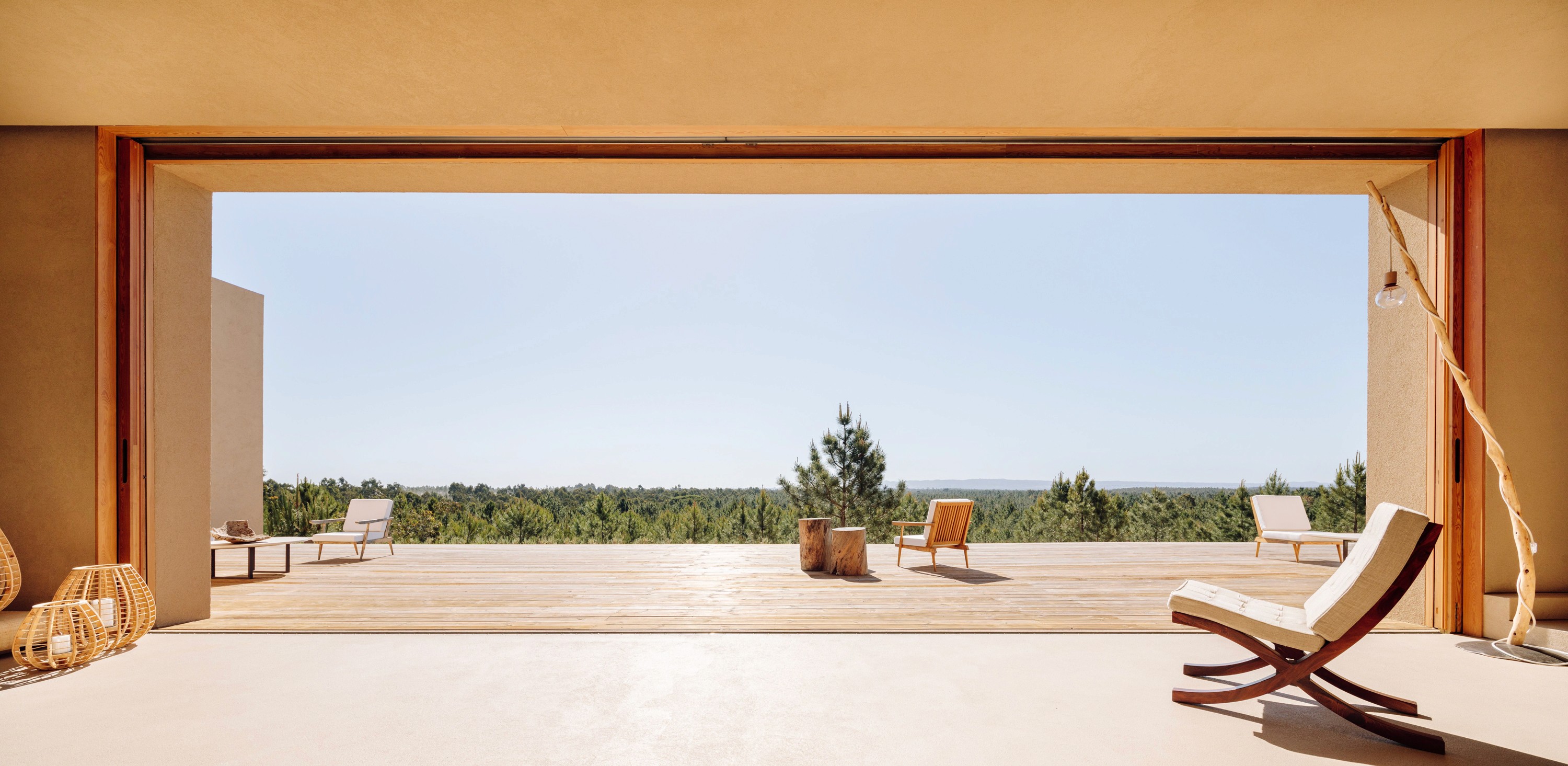 Three friends smiling in summer outfits, enjoying a sunny day outdoors. Palm trees in the background.
