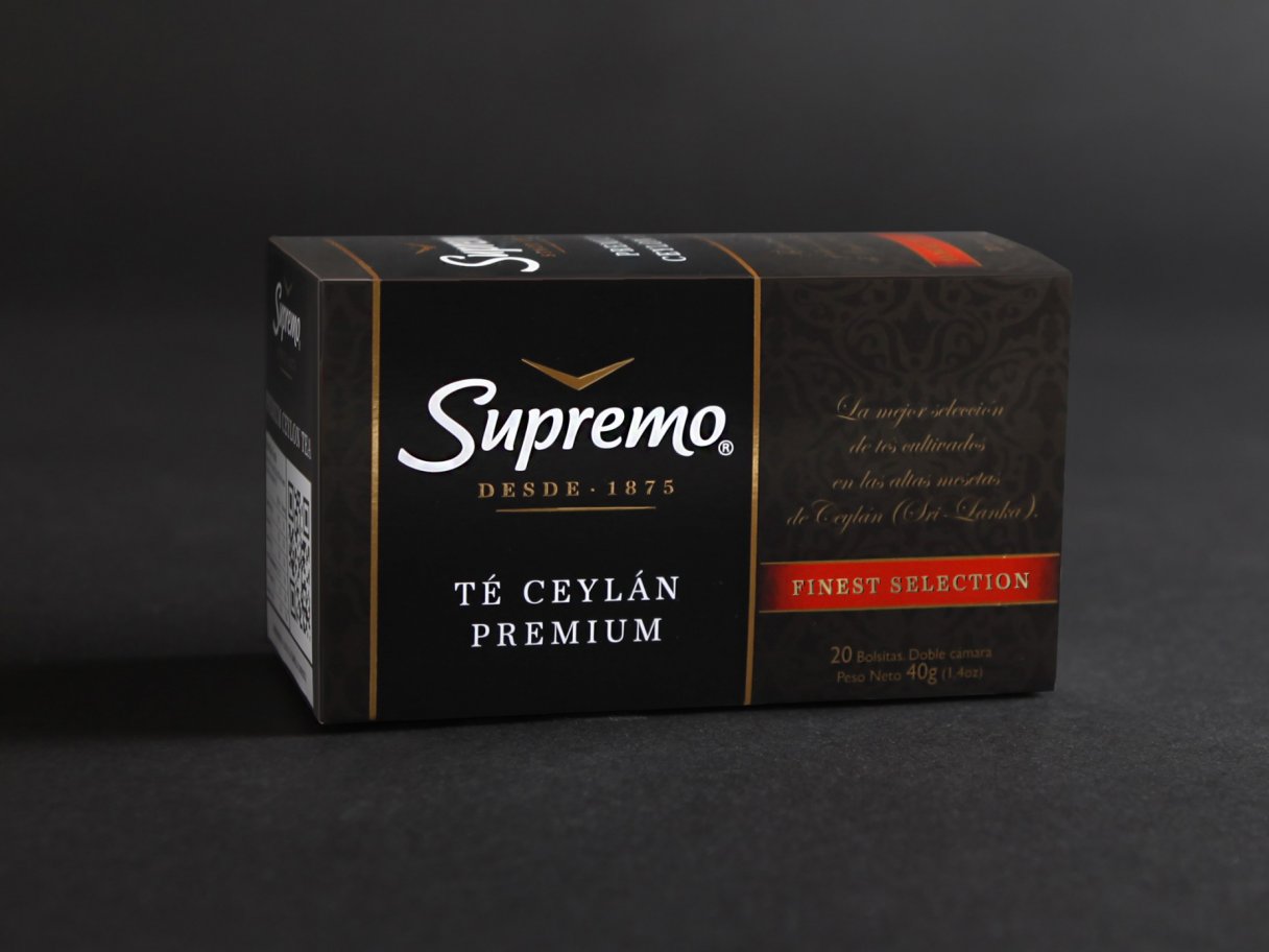 Rooftops of a coastal town with the sea in background