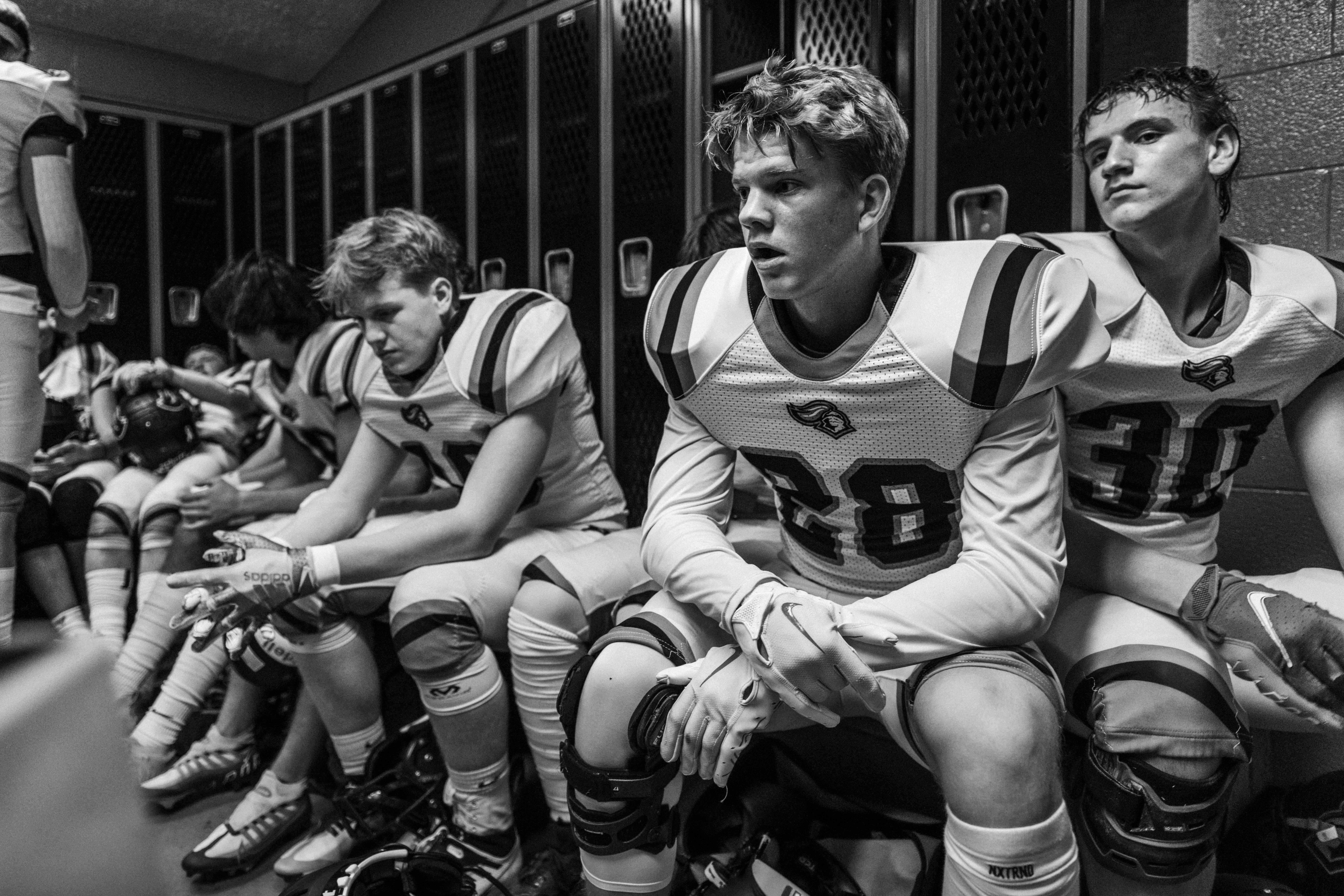 Football players in locker room after game