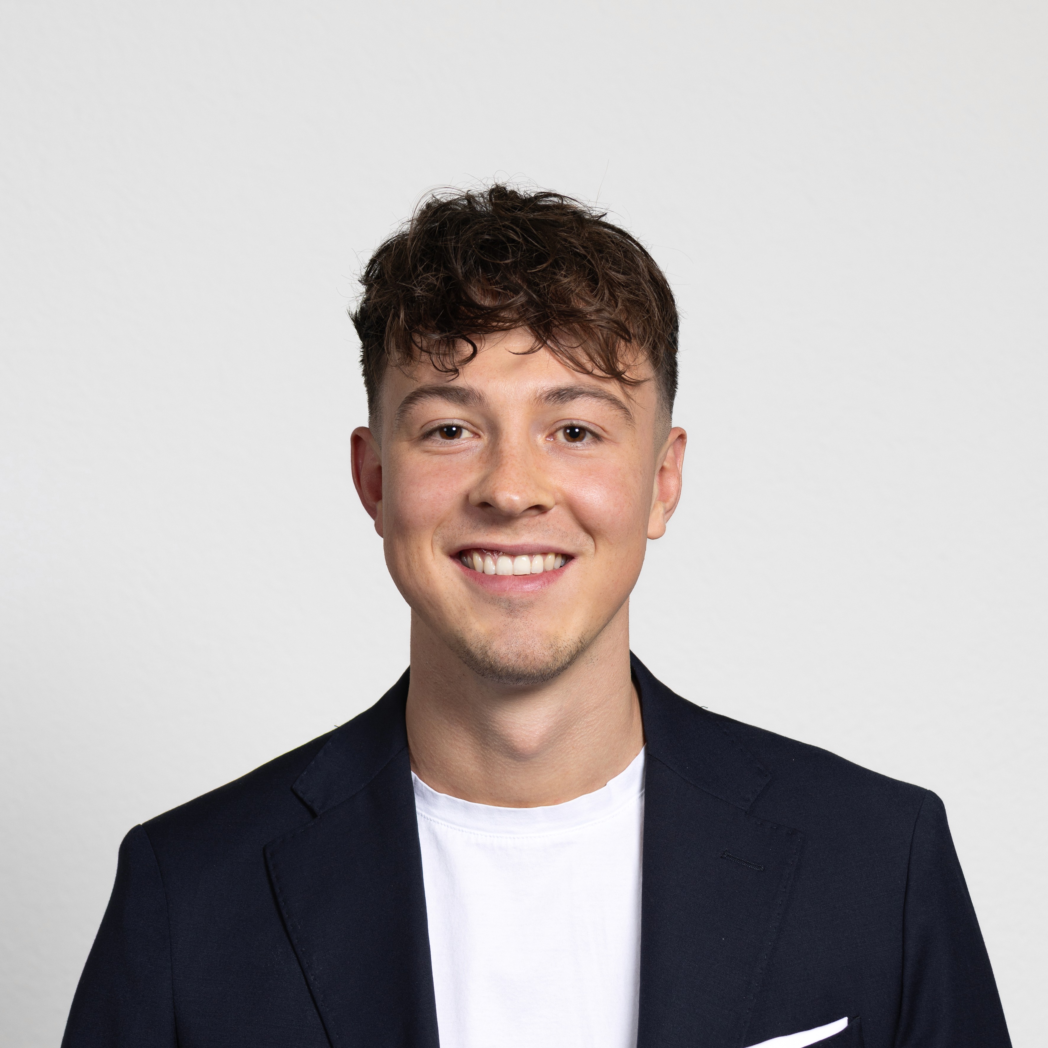 woman in white crew neck shirt smiling