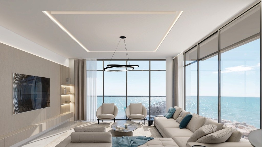 Contemporary living room with a spacious window showcasing an ocean view, part of the Anwa Aria by Omniyat project.