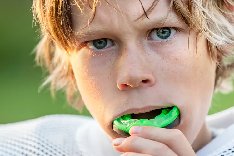 Boy with mouthguard. Dr. Rai, Arlington Dentist, Shirlington Pediatric.