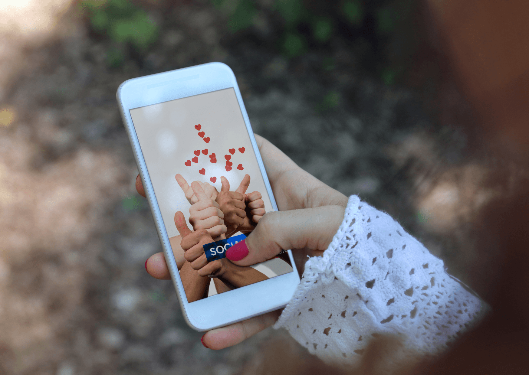 A person holding a cell phone in their hand
