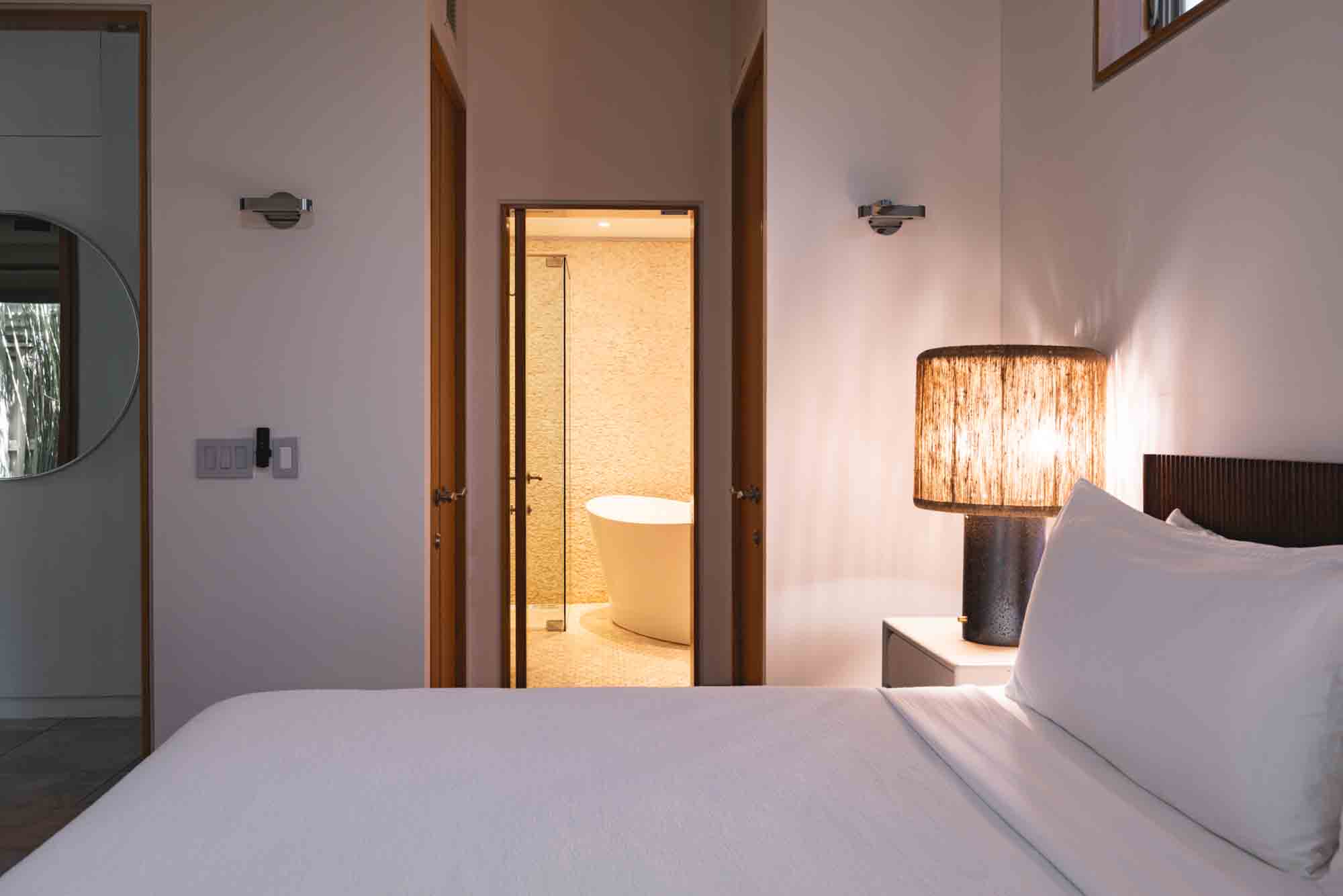 bedroom with minimalist decor, blending style and comfort in contemporary Key West lodging