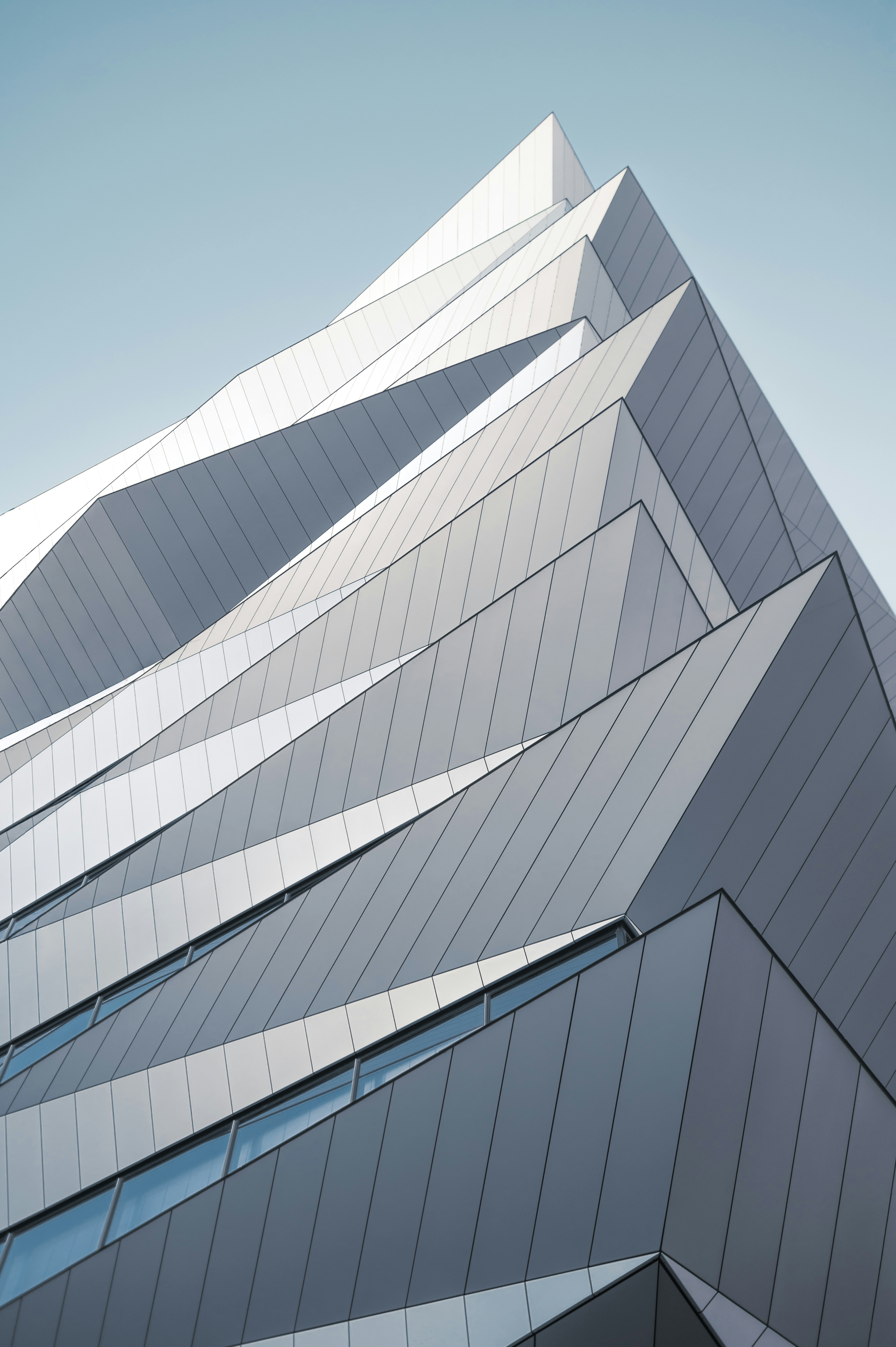 Modern building with sharp geometric angles against a clear sky.