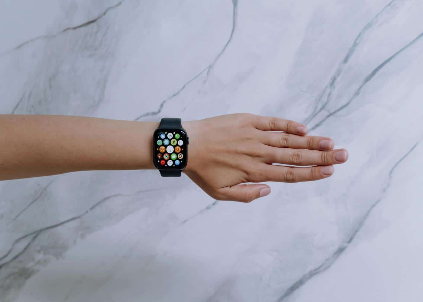 Person wearing apple watch to track sleep on iPhone