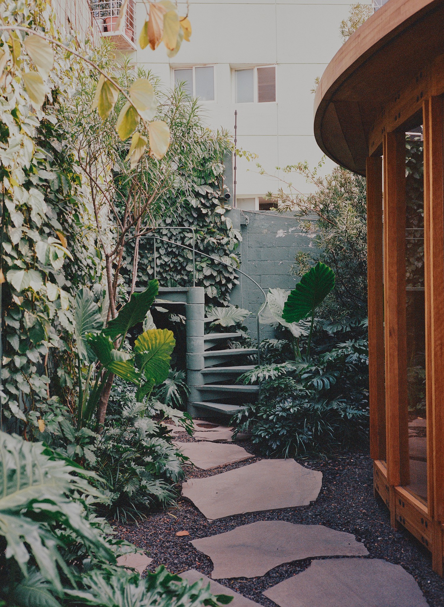 Woman with red hair covering mouth with hair