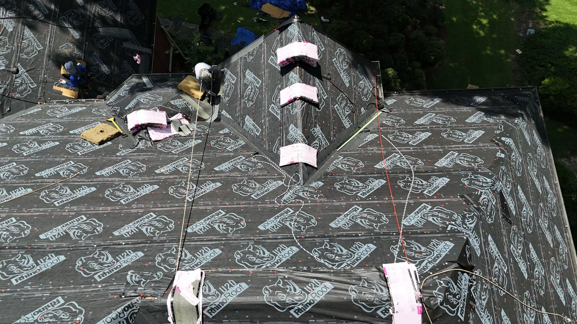 New synthetic underlayment going down during a roof replacement in Alpharetta, GA