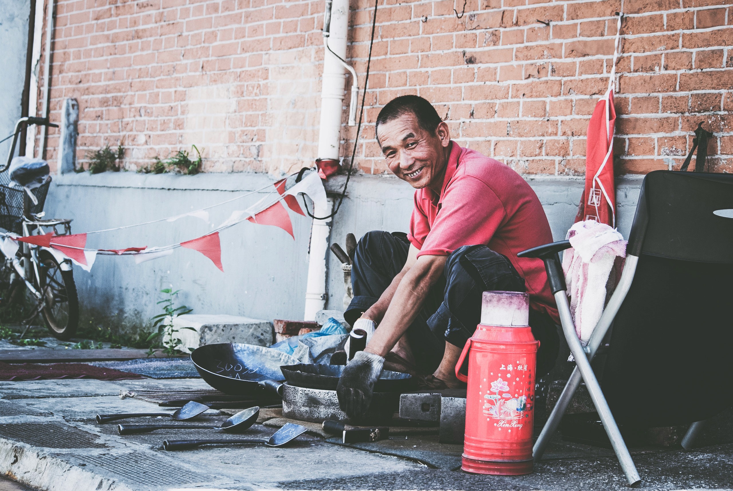 Man on the streets of China, cooking