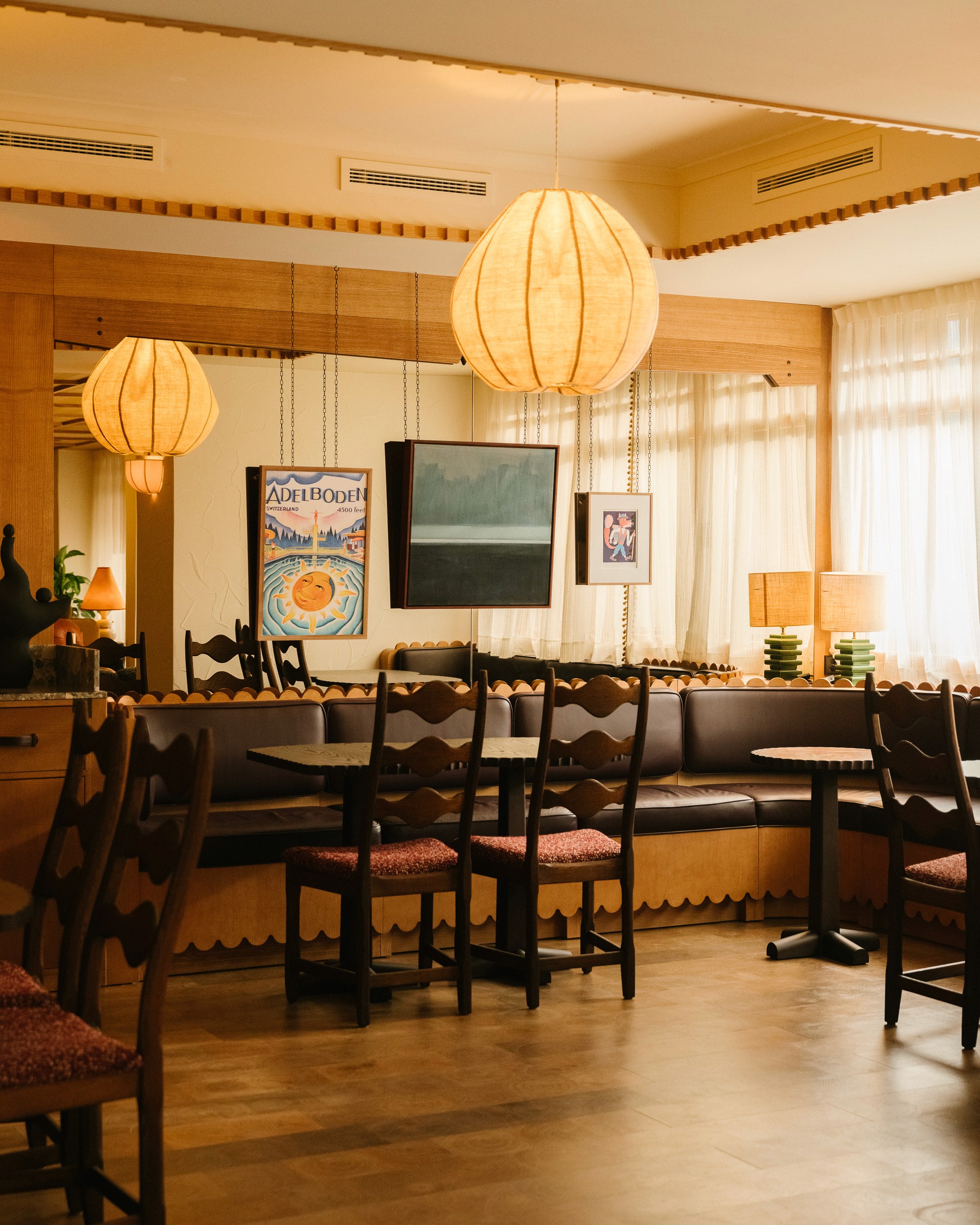 Streetside billboard with flyposters of the Batch.Works brand and illustrations