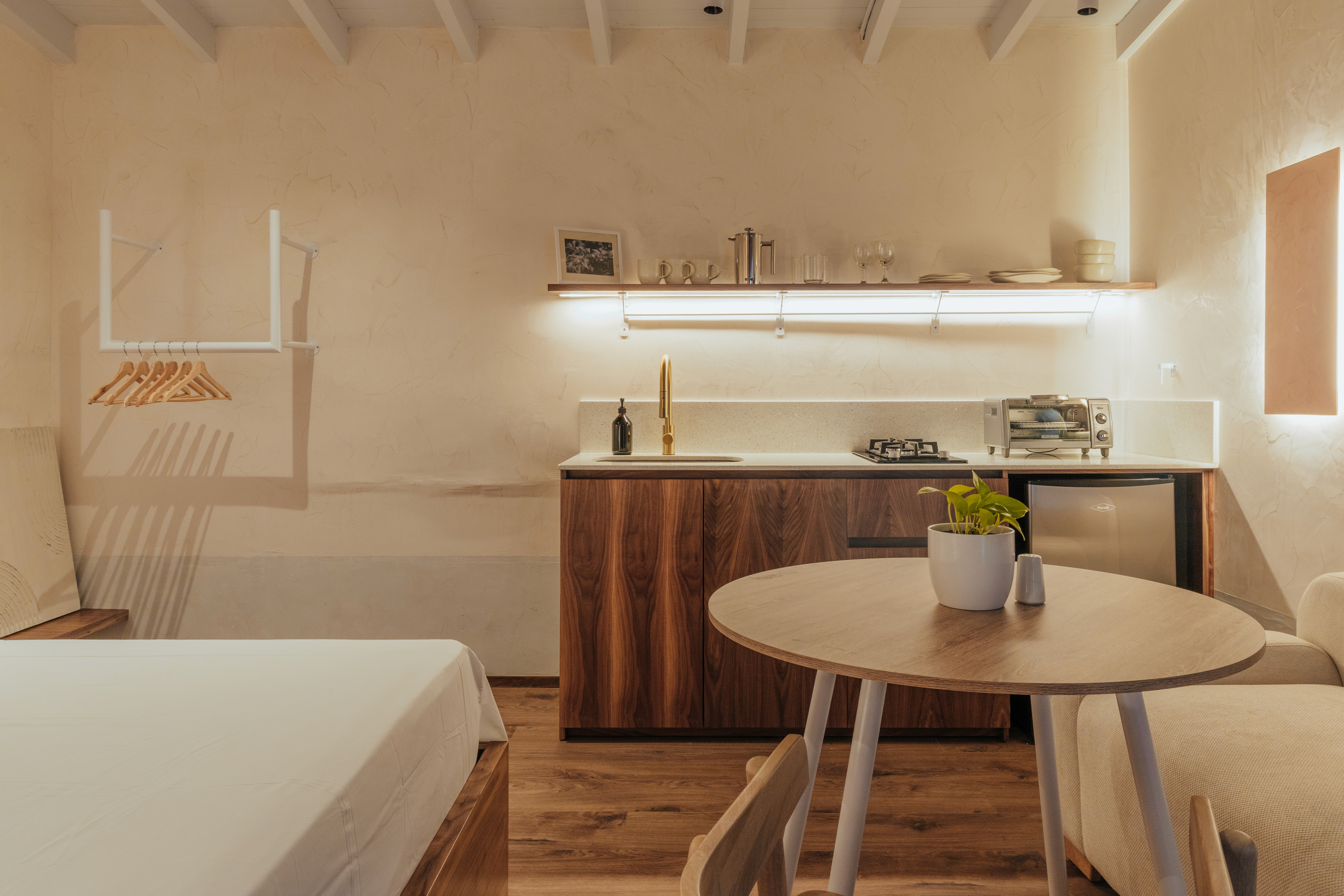 Double-height interior with flowing sculptural forms and warm raking light