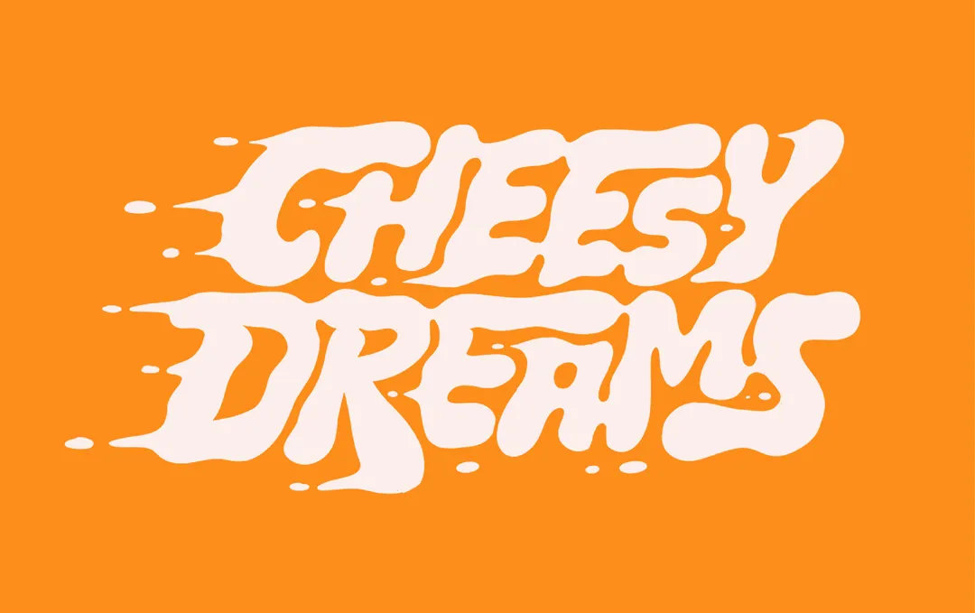 Cheesy Dreams alternate logo in bold orange drippy lettering