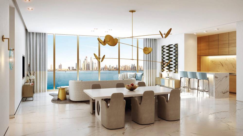 An elegant living room in The Royal Atlantis, decorated with refined gold accents that add a touch of luxury.