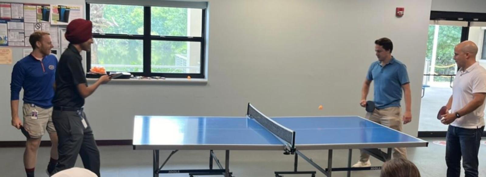 people in a large building with Tate Modern in the background