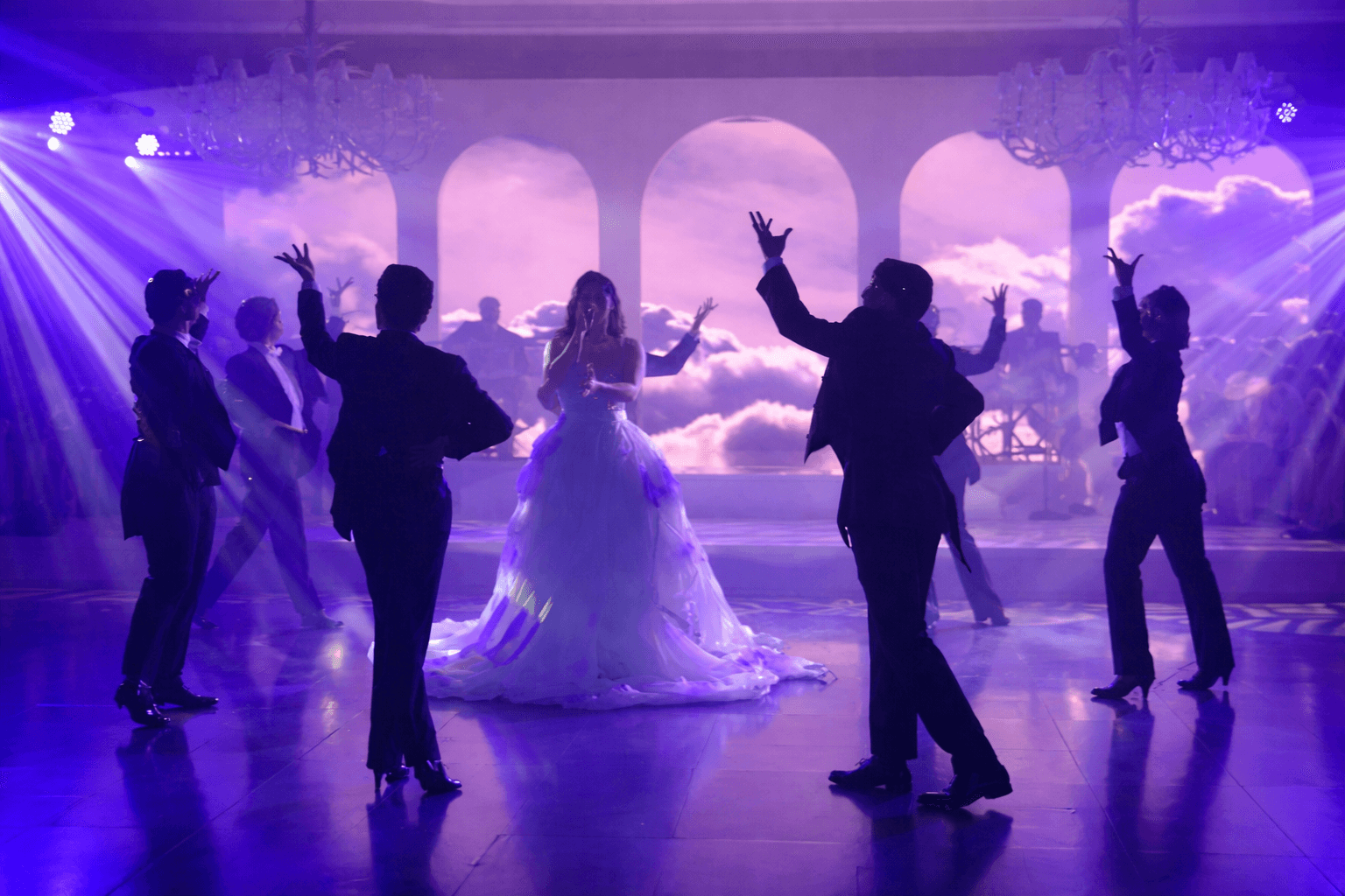 rotating disco ball supports performer