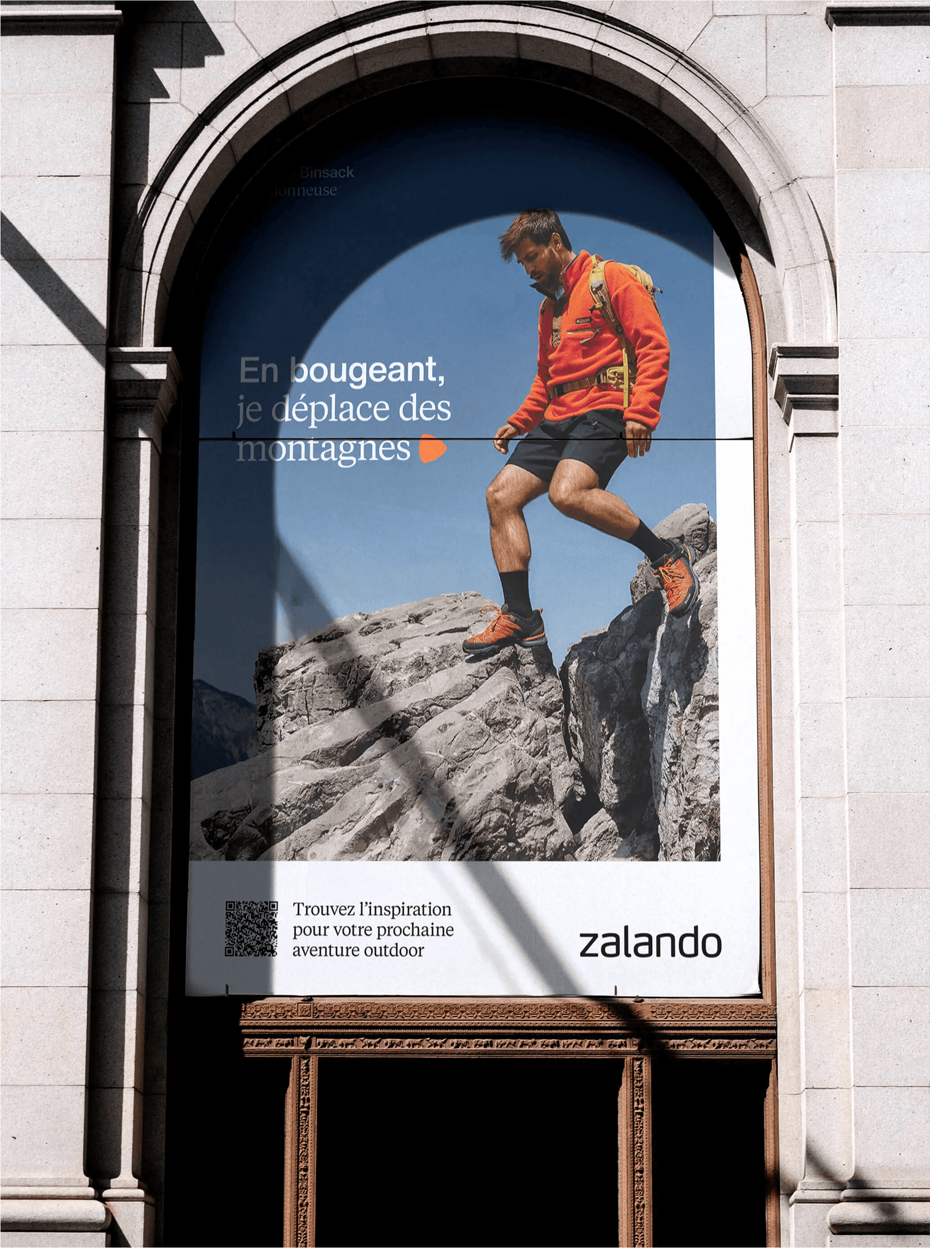 Silhouette of a person reflected on a building window