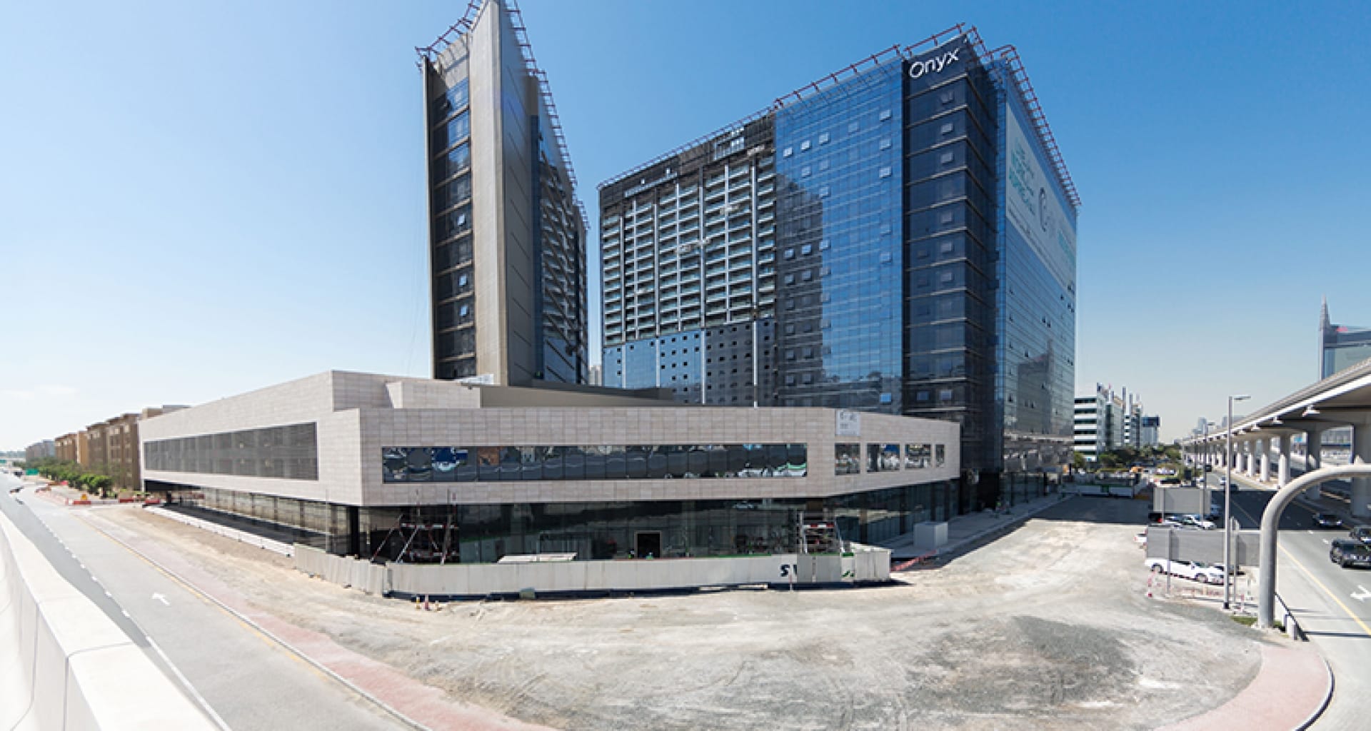 A wide shot of The Onyx Tower mixed-use development. Our real estate agency offers premium residential & commercial units.