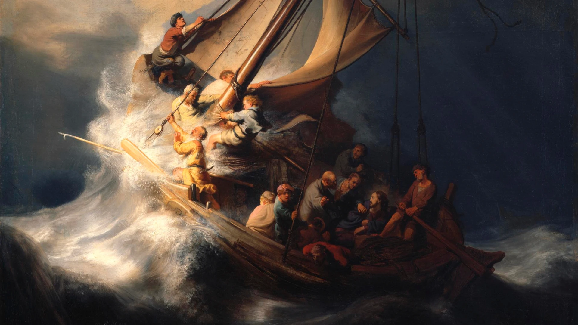 Modern architectural workspace with large floor-to-ceiling windows, surrounded by trees, and desks filled with design materials and books. Two blurred figures are walking through the space.