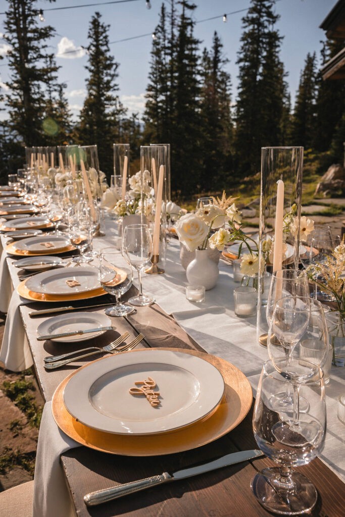 Elegant outdoor reception table setup at Smith Cabin Aspen wedding with mountain setting