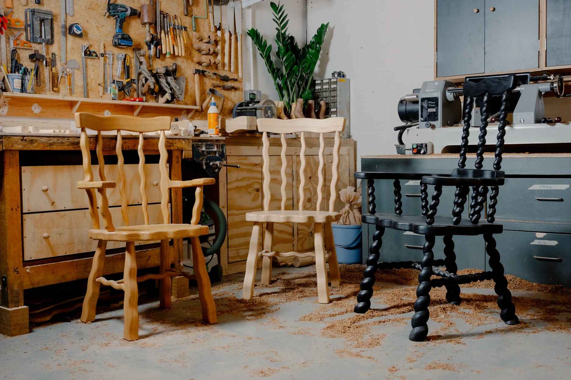3 chairs sitting in workshop