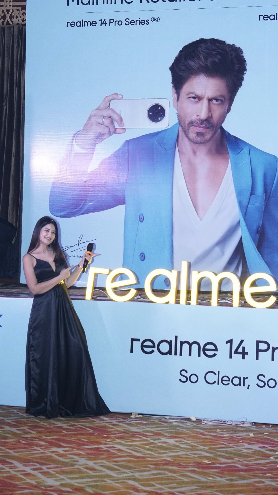 Almas Khan anchoring a corporate conference on stage