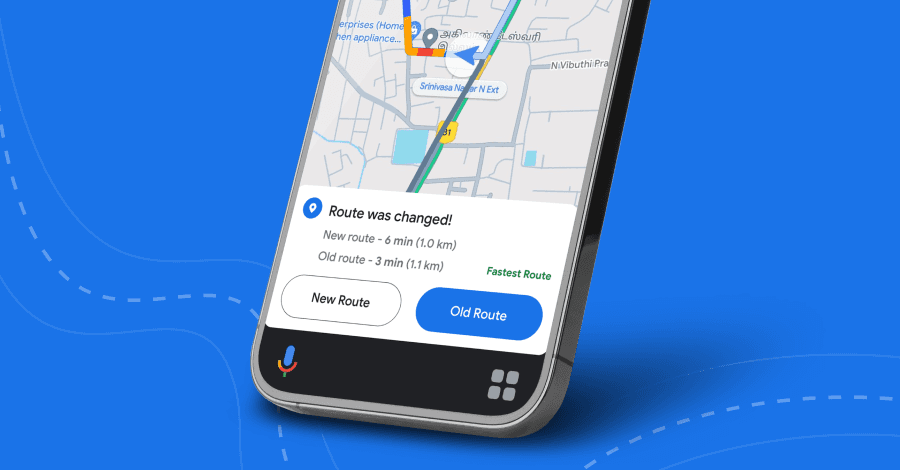 A man with long hair is working on a computer.