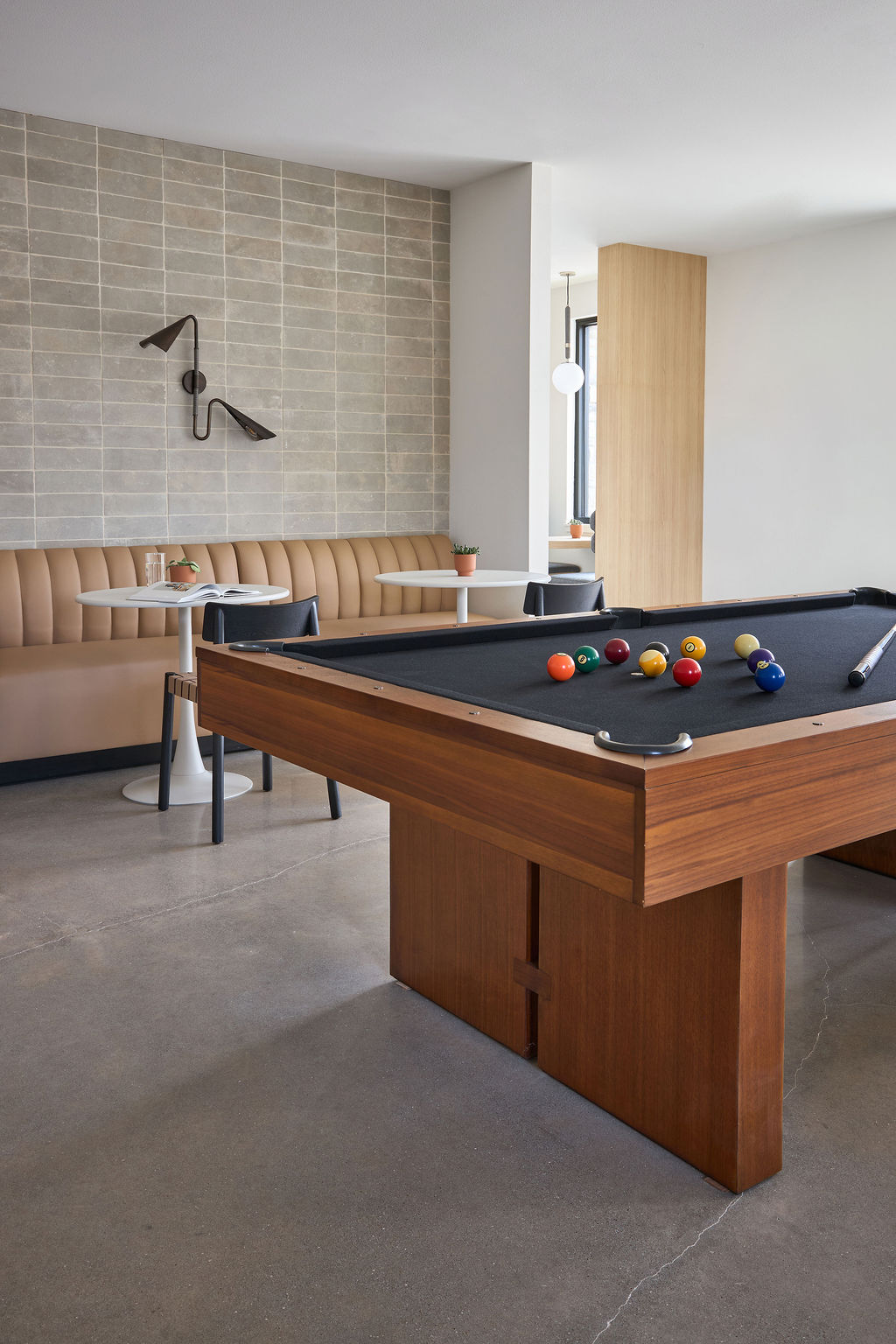 Entertainment area with view of stairs leading upstairs