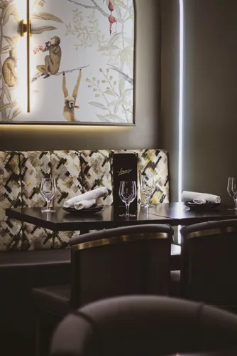 Normans orlando Kitchen Restaurant interior detail showing framed artwork and textured wall design