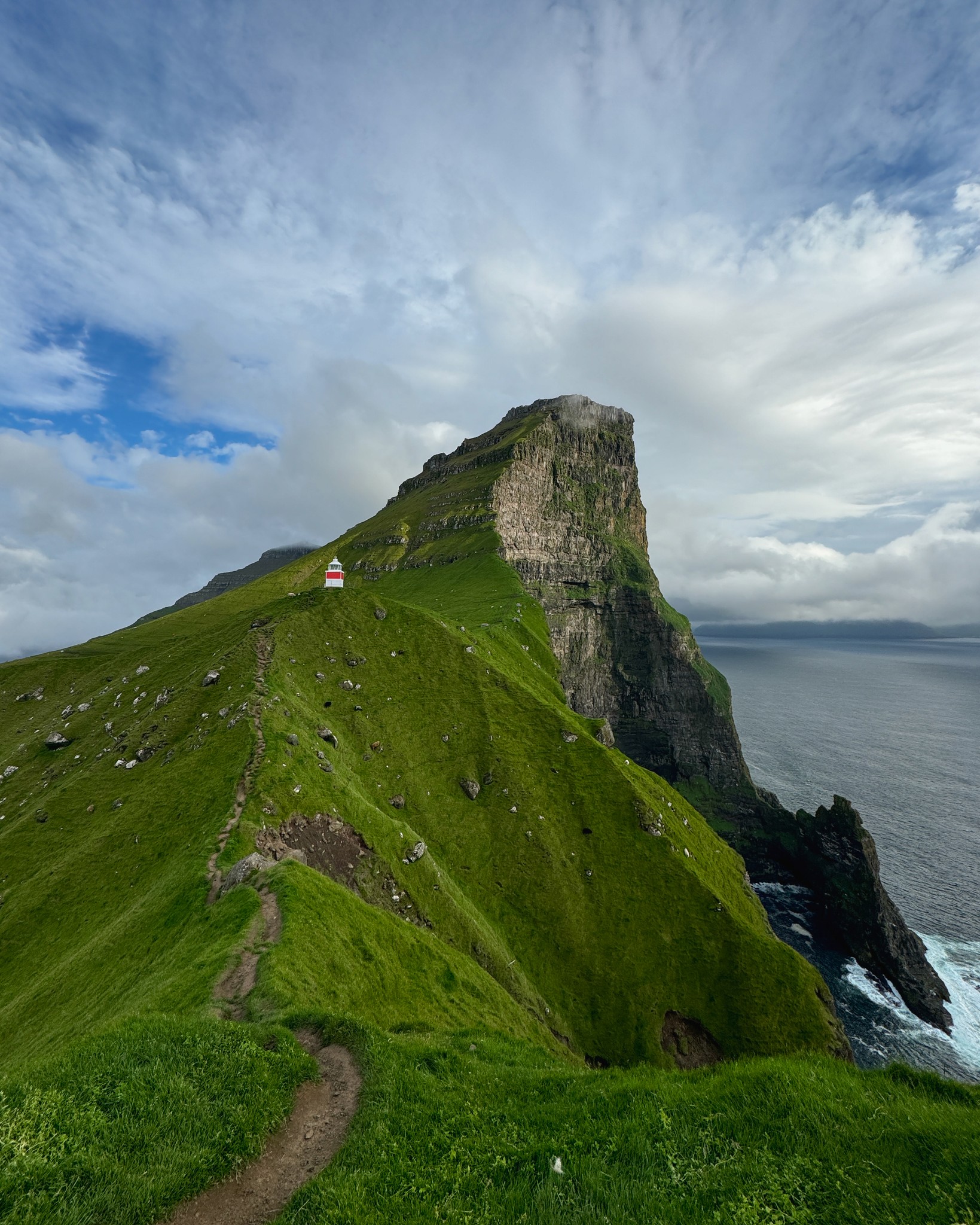 A mountain with a light house