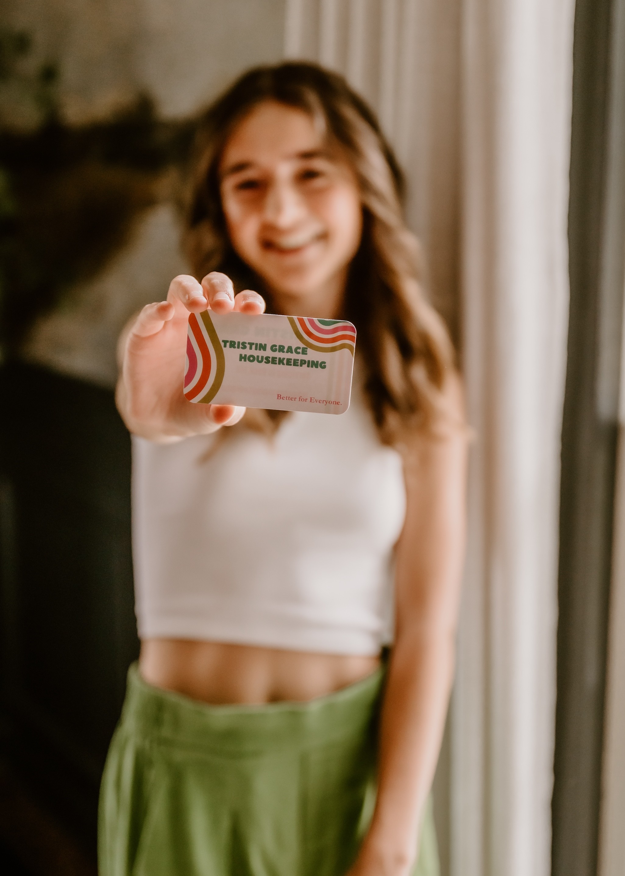Tristin Grace Holding Her Business Card