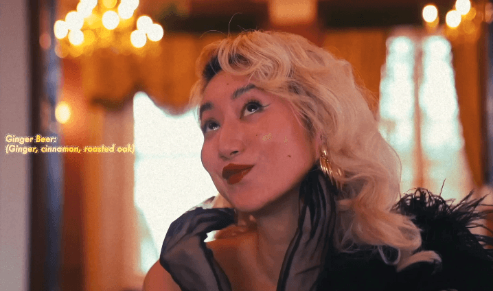 Tree branches against white house and fence