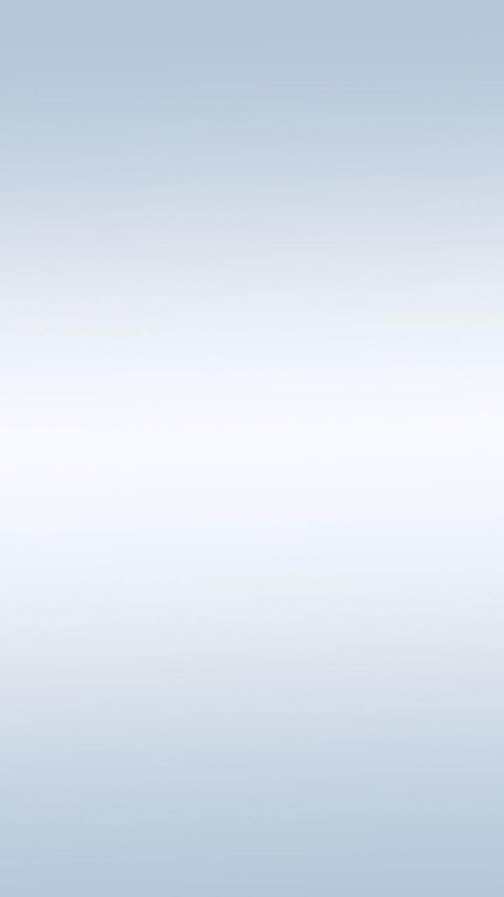 two people looking at a tablet and smiling